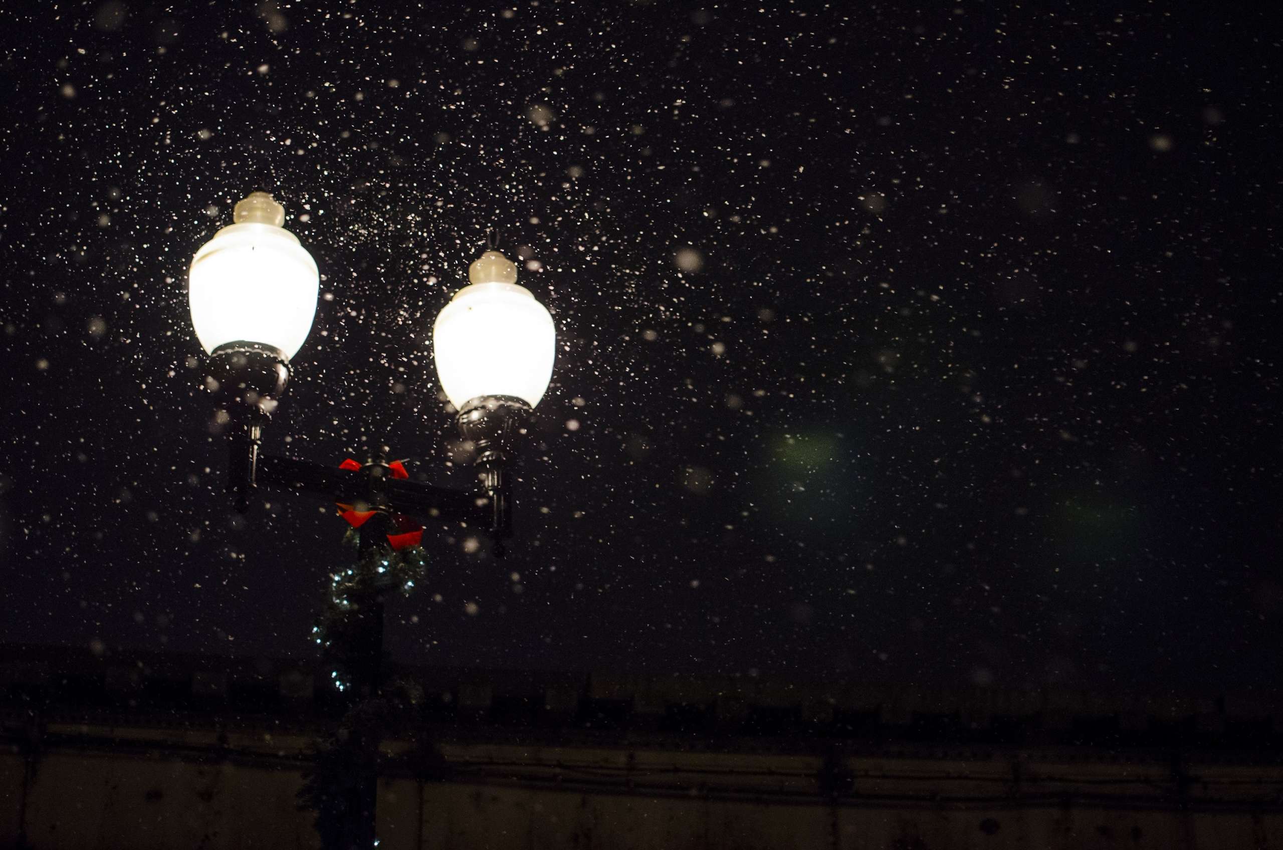 Old-fashioned streetlight with snow