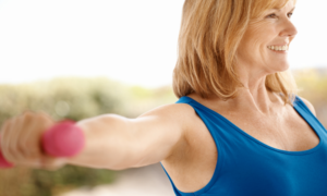 middle age woman lifting weight