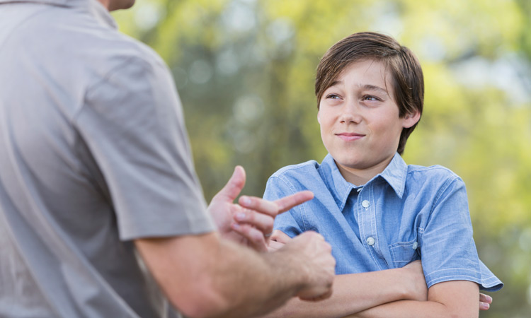 father talking to teenage son