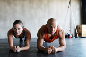 couple doing plank exercise