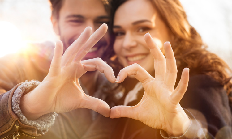 couple making heart shape