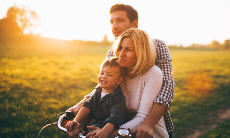 Honoring-Spring-As-A-Family-family-riiding-bicycle-in-outdoors