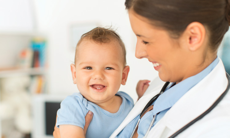 Doctor holding baby Inform Yourself About Autism And Vaccines