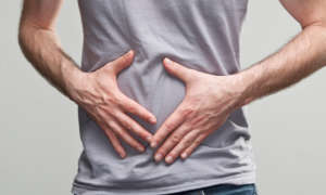 Holding stomach The Gut Human Microbiome