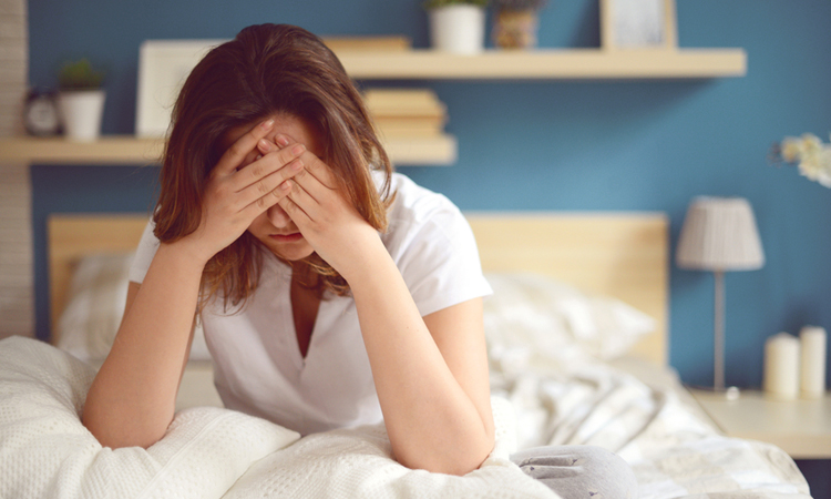 Unhappy-or-depressed waking up hands on face