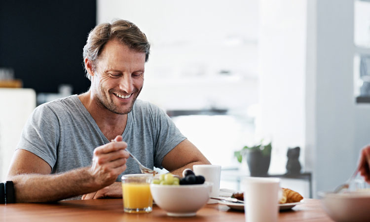 man eating breakfast