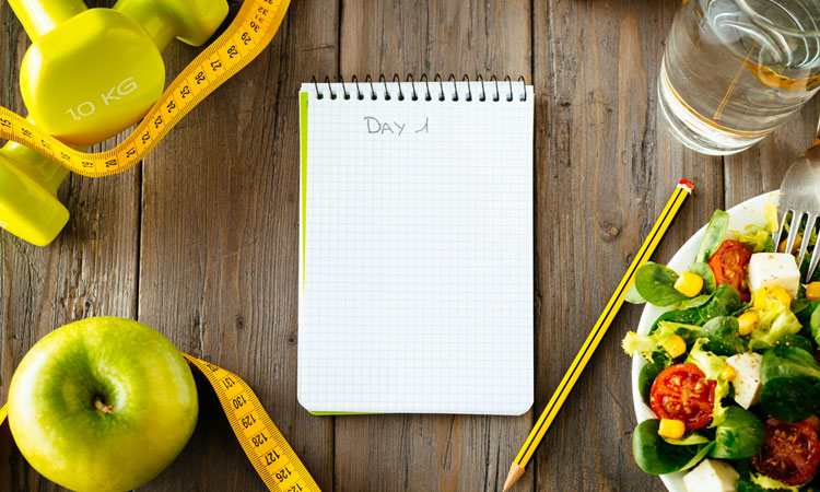 health journal note with exercise equipment