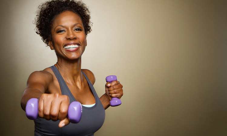woman exercising with light weights