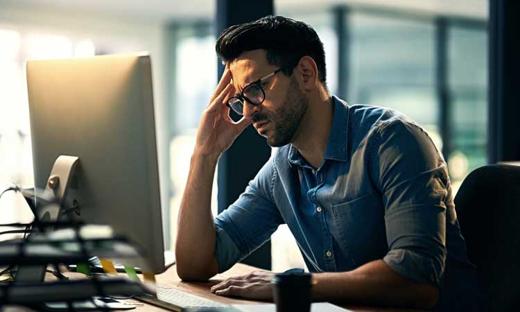 man working looking stressed