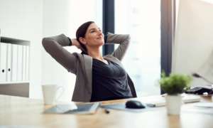 How-To-Find-Zen-At-Work-Amidst-The-Chaos woman relaxed at work