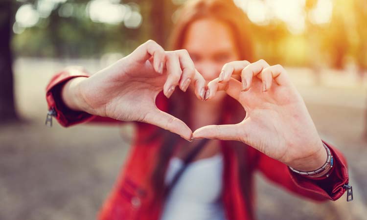 Heart Intelligence woman making heart sign