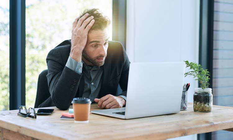 Why-Youve-Hit-a-Career-Wall-and-What-To-Do-About-It man frustrated at work