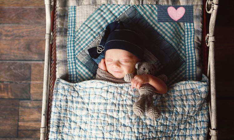 Your-Life-Is-An-Interactive-Quilt baby sleeping on a quilt