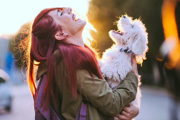 woman and dog sharing the same energy