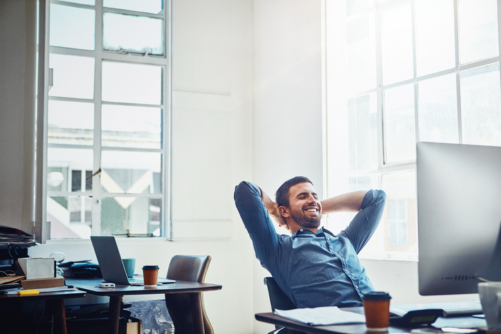 young man relaxing on his work desk