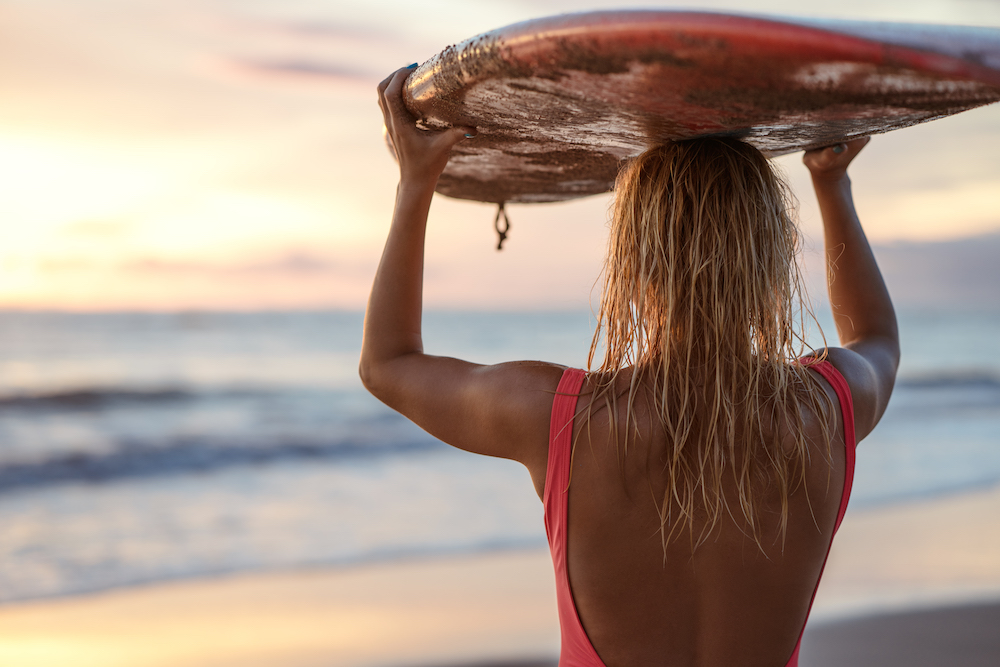 Young surfer woman faces challenges to change mindset