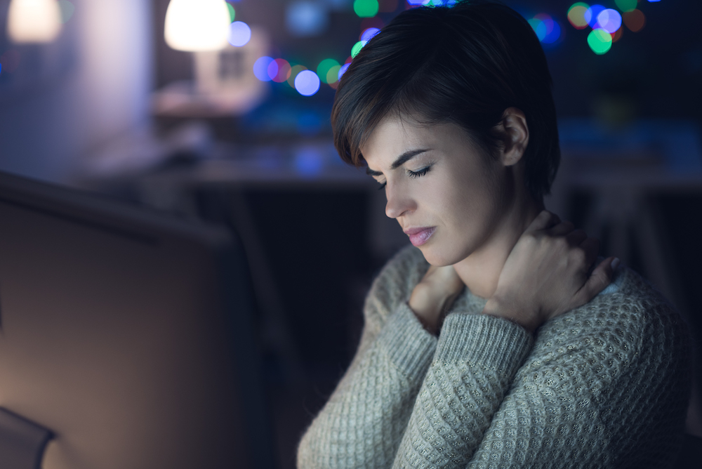 Woman suffering from chronic neck pain